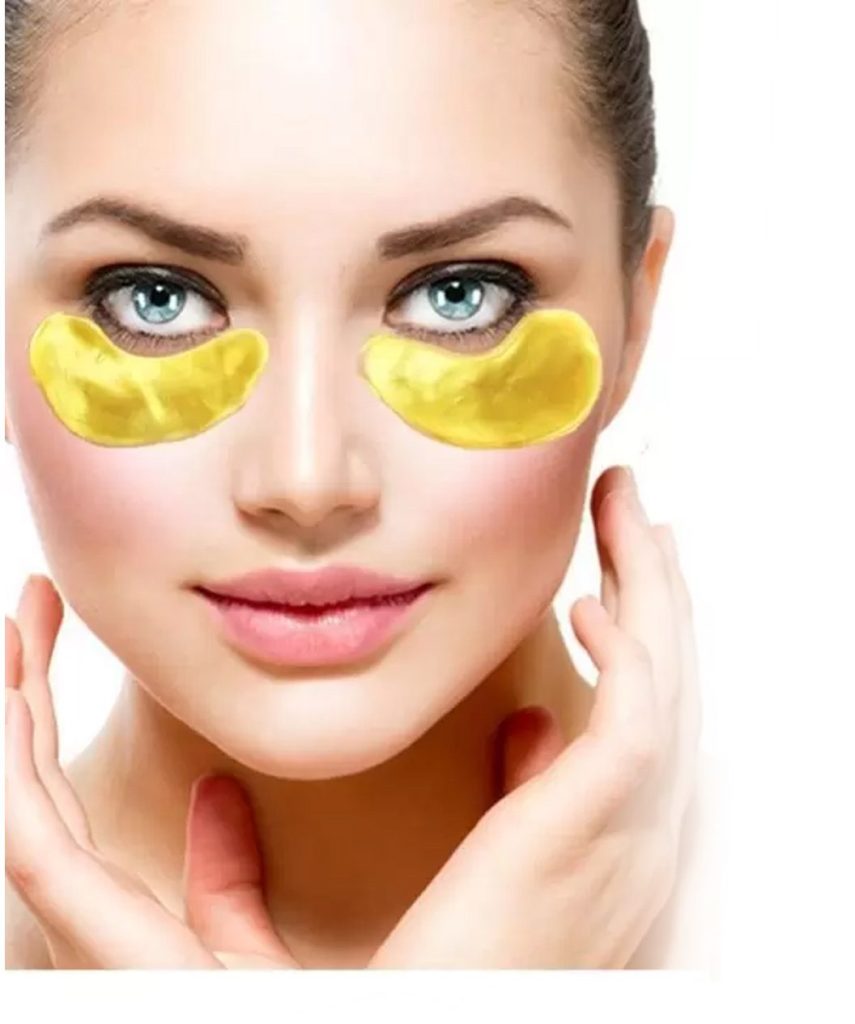 Model wearing EELHOE gold under-eye patches